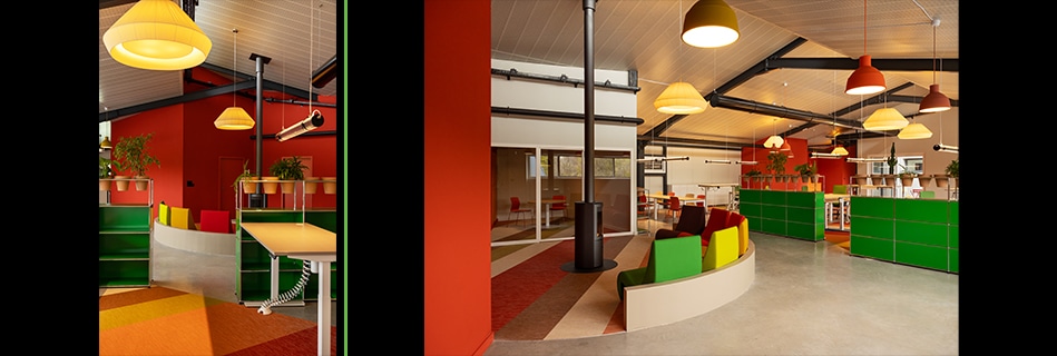 Meubles de rangement vert vif et sol à bandes colorées, et plateau de bureaux ouvert sous charpente noire et suspensions