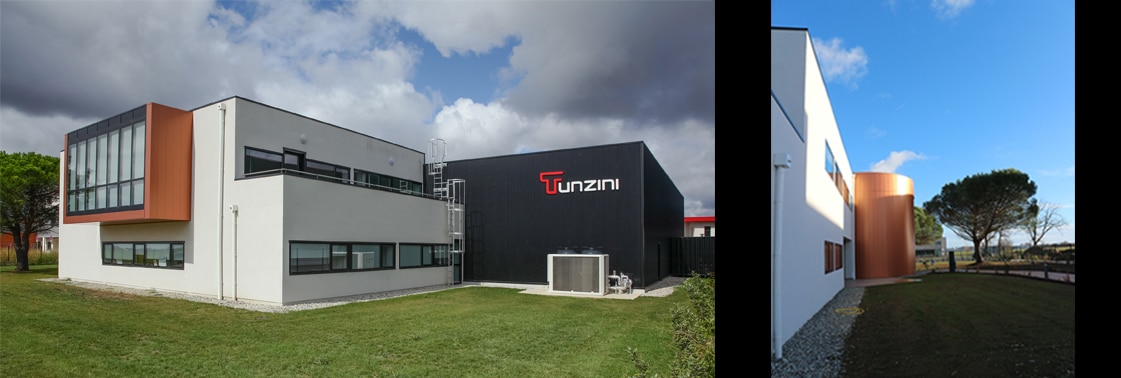 Le bâtiment de bureaux blanc et son volume d'atelier noir signé Tunzini, et la tour d'escalier courbe en bardage cuivré près d'un pin parasol