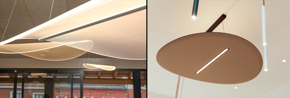 Suspensions design en tissu aux formes de pétales et luminaire acoustique rond au-dessus des postes de travail